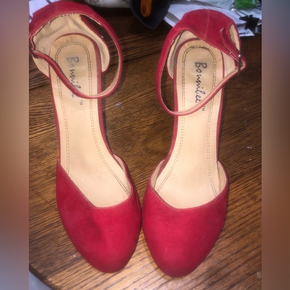 Red faux velvet high heels.